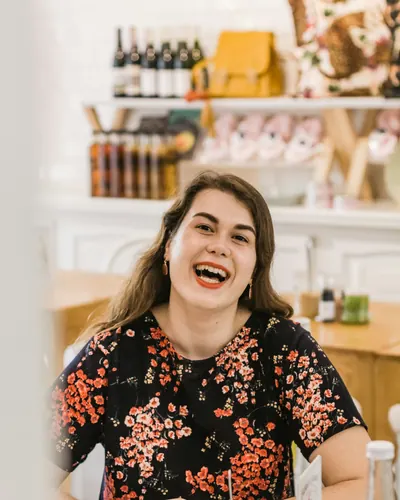 Boutique owner smiling in her shop